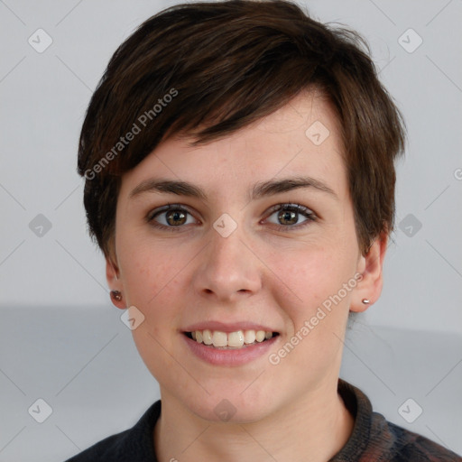 Joyful white young-adult female with short  brown hair and grey eyes