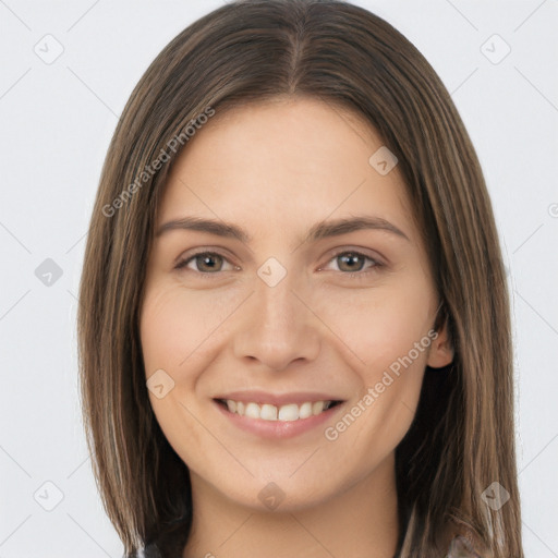 Joyful white young-adult female with long  brown hair and grey eyes