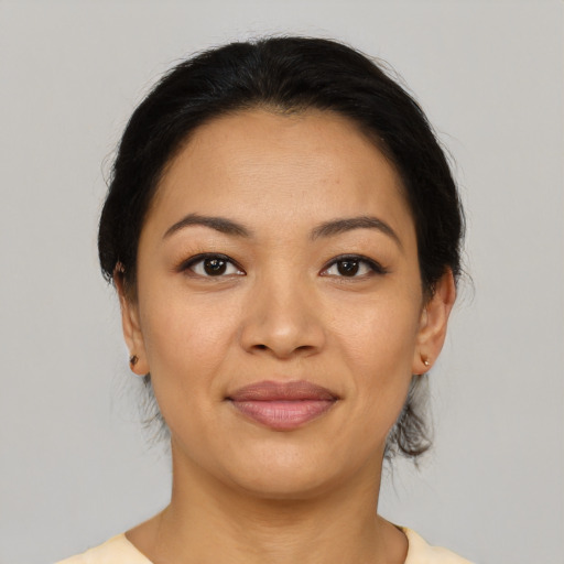 Joyful asian young-adult female with medium  brown hair and brown eyes