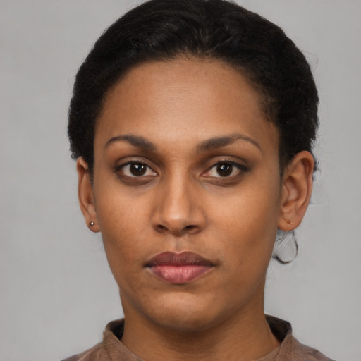 Neutral latino young-adult female with short  black hair and brown eyes