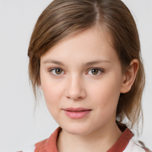 Joyful white child female with medium  brown hair and grey eyes