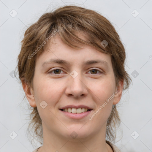 Joyful white young-adult female with medium  brown hair and grey eyes