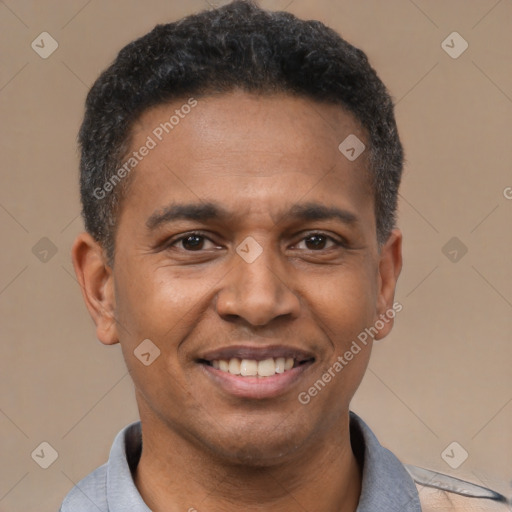 Joyful latino adult male with short  black hair and brown eyes