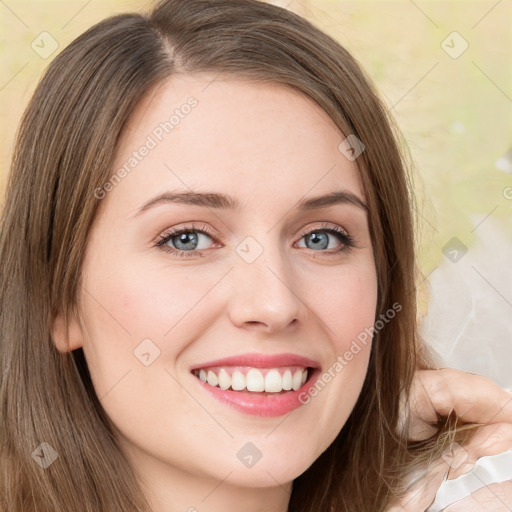 Joyful white young-adult female with long  brown hair and green eyes