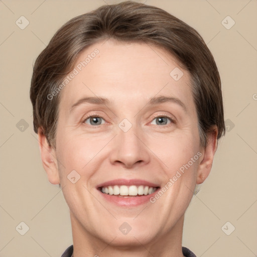 Joyful white adult female with short  brown hair and grey eyes