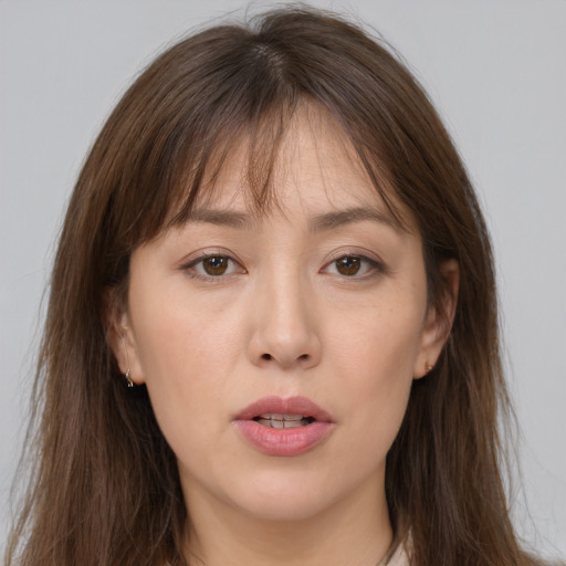 Neutral white young-adult female with long  brown hair and brown eyes
