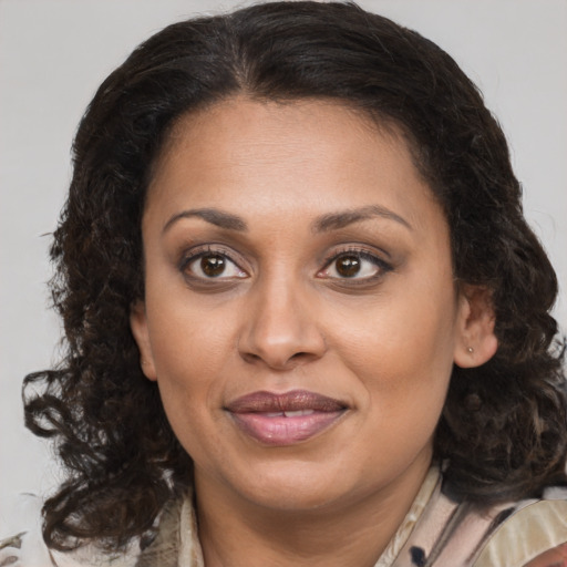 Joyful white adult female with medium  brown hair and brown eyes