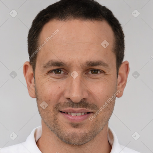 Joyful white adult male with short  brown hair and brown eyes