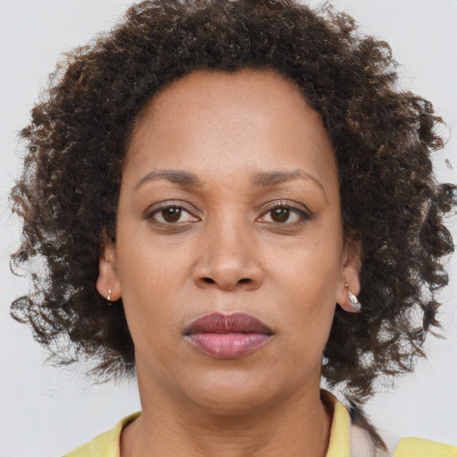 Neutral black adult female with medium  brown hair and brown eyes