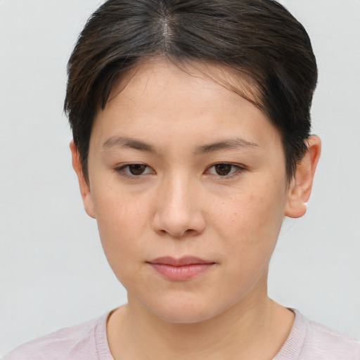 Neutral white young-adult female with short  brown hair and brown eyes