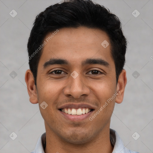 Joyful latino young-adult male with short  black hair and brown eyes