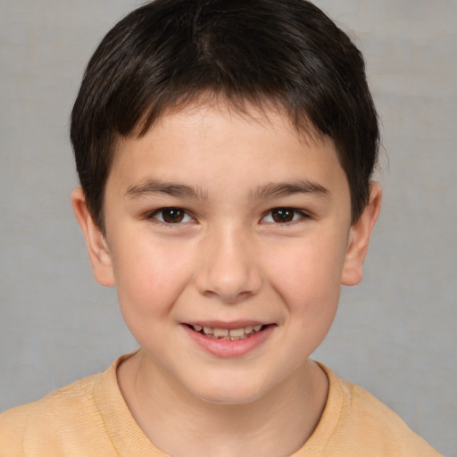 Joyful white child male with short  brown hair and brown eyes