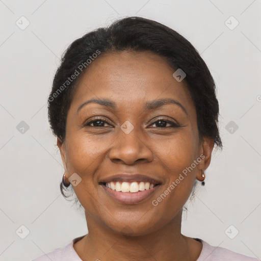 Joyful black adult female with short  brown hair and brown eyes