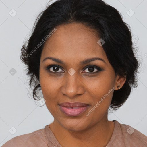 Joyful black young-adult female with medium  brown hair and brown eyes