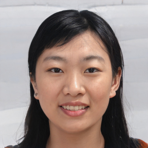Joyful white young-adult female with medium  black hair and brown eyes