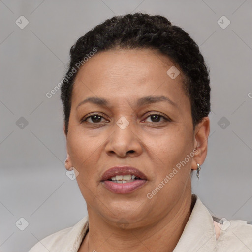 Joyful latino adult female with short  brown hair and brown eyes