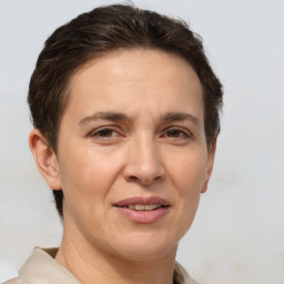 Joyful white adult female with short  brown hair and brown eyes