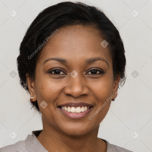 Joyful black young-adult female with short  brown hair and brown eyes