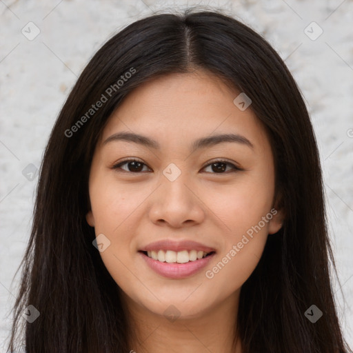 Joyful asian young-adult female with long  brown hair and brown eyes