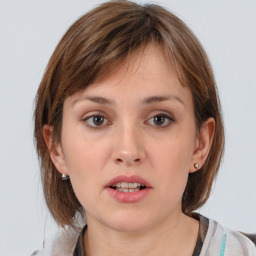 Neutral white young-adult female with medium  brown hair and brown eyes