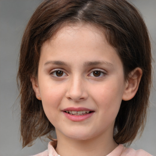 Joyful white child female with medium  brown hair and brown eyes