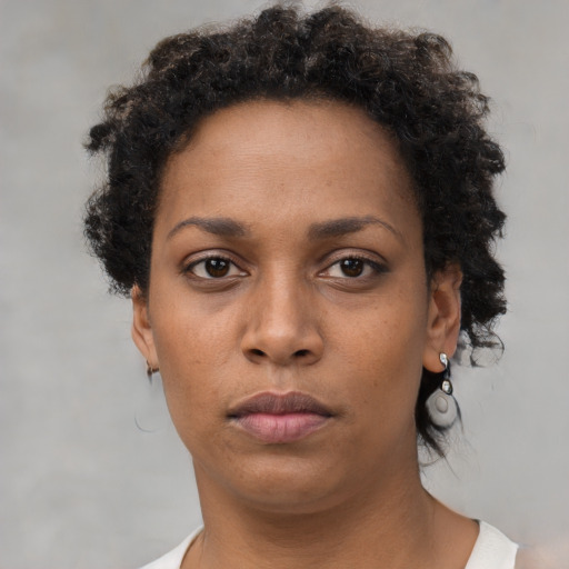 Neutral black young-adult female with short  brown hair and brown eyes