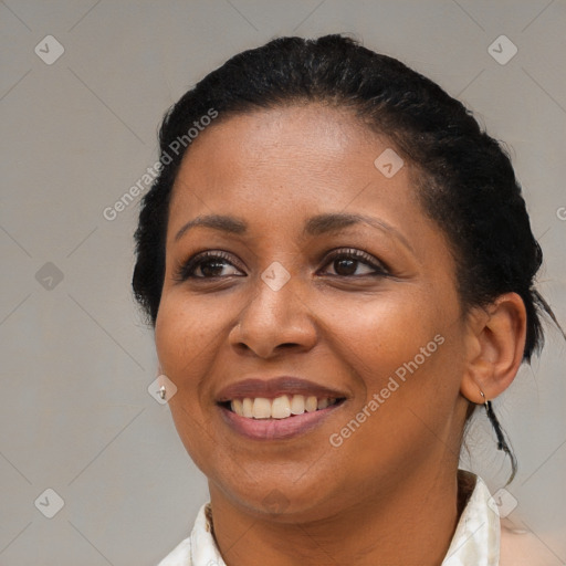 Joyful black young-adult female with medium  brown hair and brown eyes