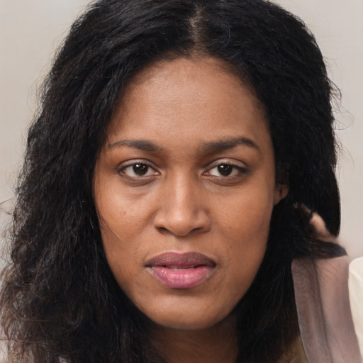 Joyful latino young-adult female with long  black hair and brown eyes
