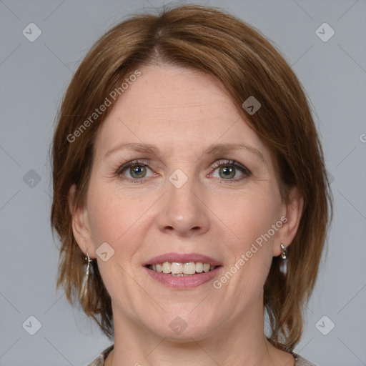 Joyful white adult female with medium  brown hair and grey eyes