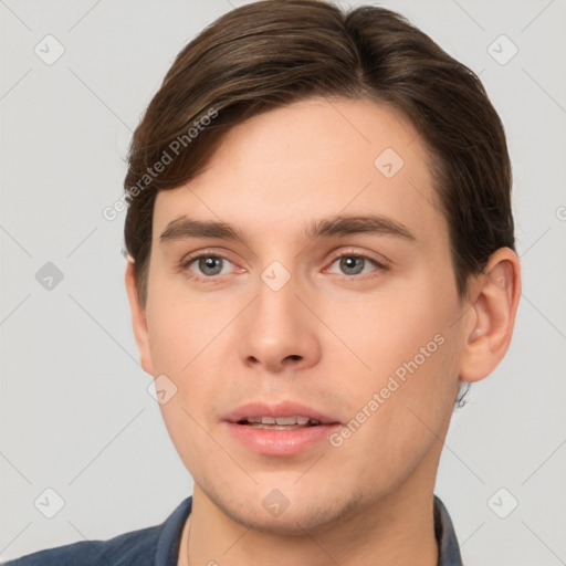 Neutral white young-adult male with short  brown hair and brown eyes