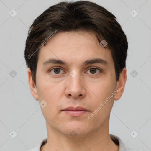 Neutral white young-adult male with short  brown hair and brown eyes