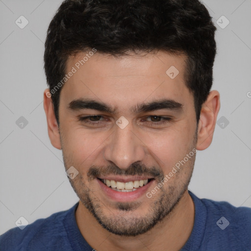 Joyful white young-adult male with short  black hair and brown eyes