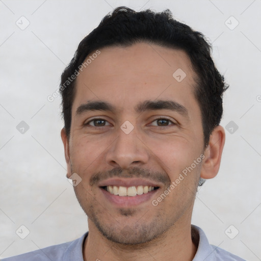 Joyful white young-adult male with short  black hair and brown eyes