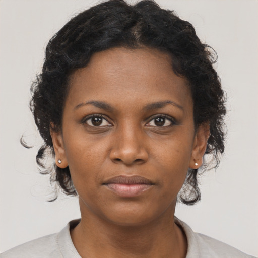 Neutral black young-adult female with short  brown hair and brown eyes
