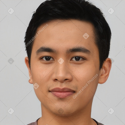 Joyful asian young-adult male with short  black hair and brown eyes