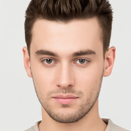 Neutral white young-adult male with short  brown hair and brown eyes