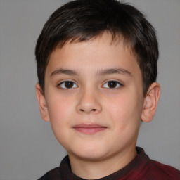 Joyful white child male with short  brown hair and brown eyes