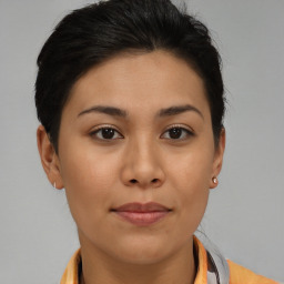 Joyful asian young-adult female with short  brown hair and brown eyes