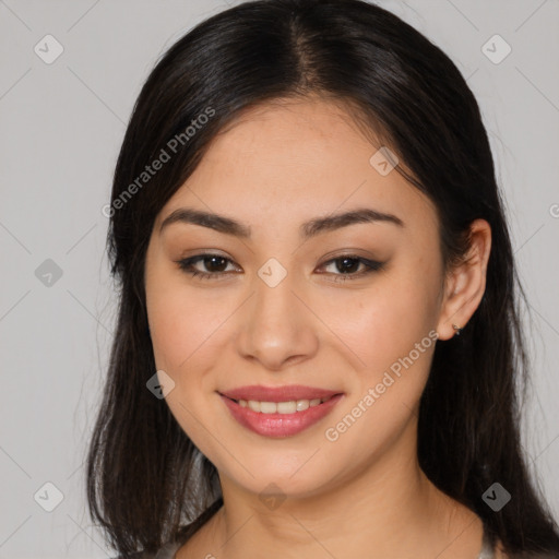 Joyful asian young-adult female with long  brown hair and brown eyes