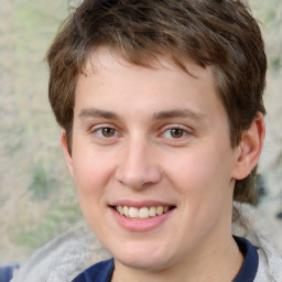 Joyful white young-adult male with medium  brown hair and brown eyes