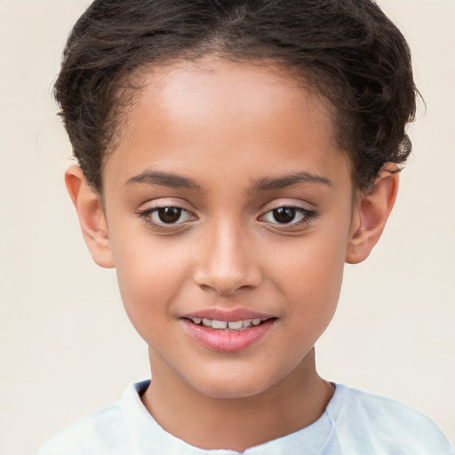 Joyful white child female with short  brown hair and brown eyes