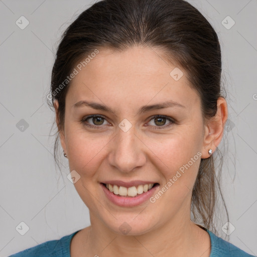 Joyful white young-adult female with medium  brown hair and grey eyes