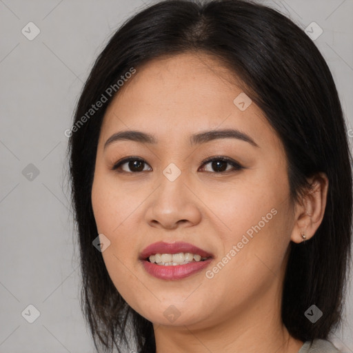 Joyful asian young-adult female with long  brown hair and brown eyes