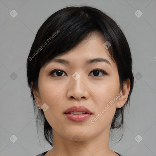 Joyful asian young-adult female with medium  black hair and brown eyes