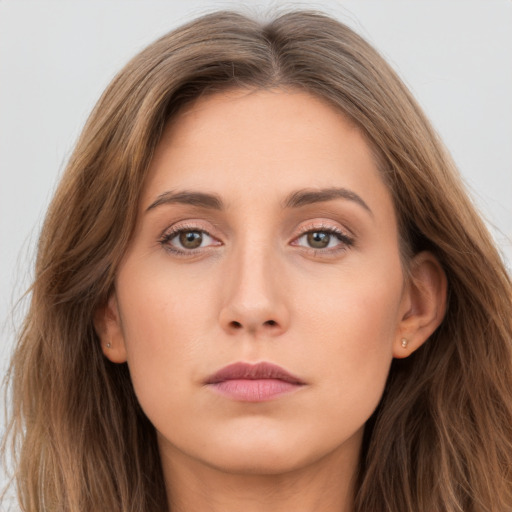 Neutral white young-adult female with long  brown hair and brown eyes