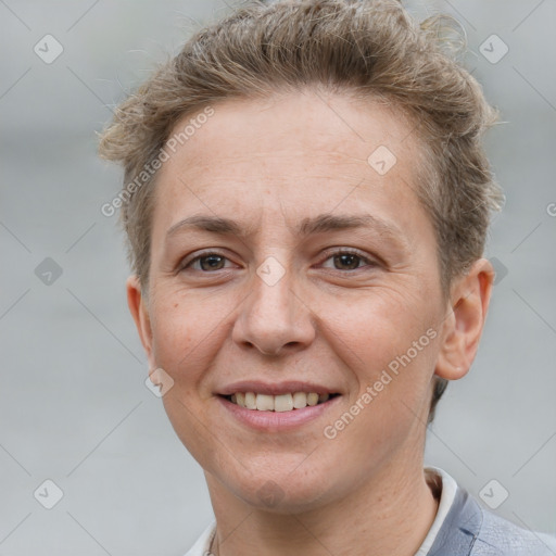 Joyful white adult female with short  brown hair and grey eyes