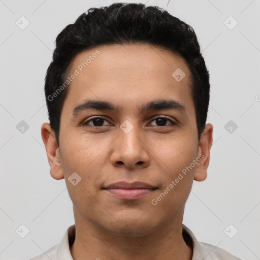 Joyful latino young-adult male with short  brown hair and brown eyes