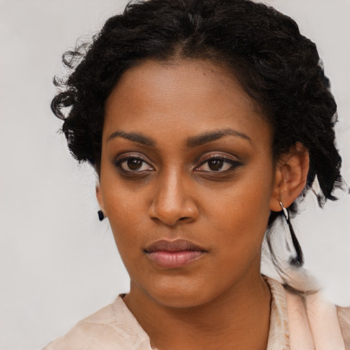 Neutral black young-adult female with short  brown hair and brown eyes