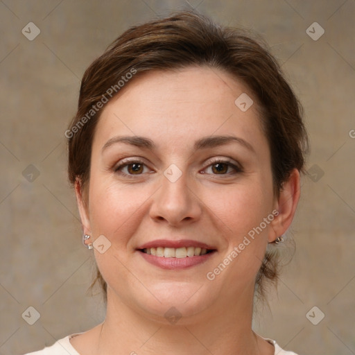 Joyful white young-adult female with medium  brown hair and green eyes