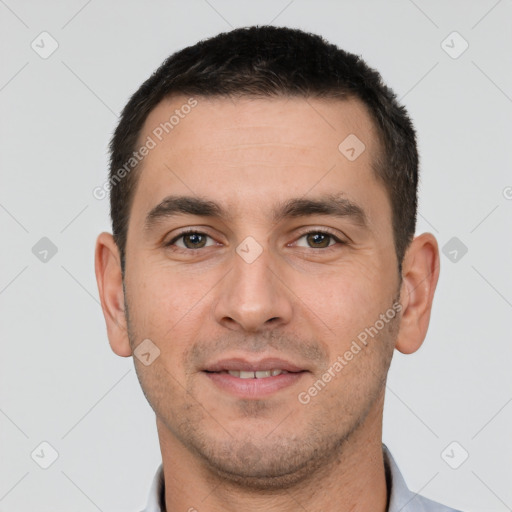 Joyful white young-adult male with short  brown hair and brown eyes